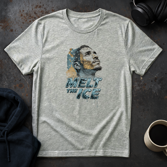 Ice grey humanitarian t-shirt featuring a symbolic immigrant portrait and the message "Immigrants Belong!" expressing belonging, dignity, and shared humanity.