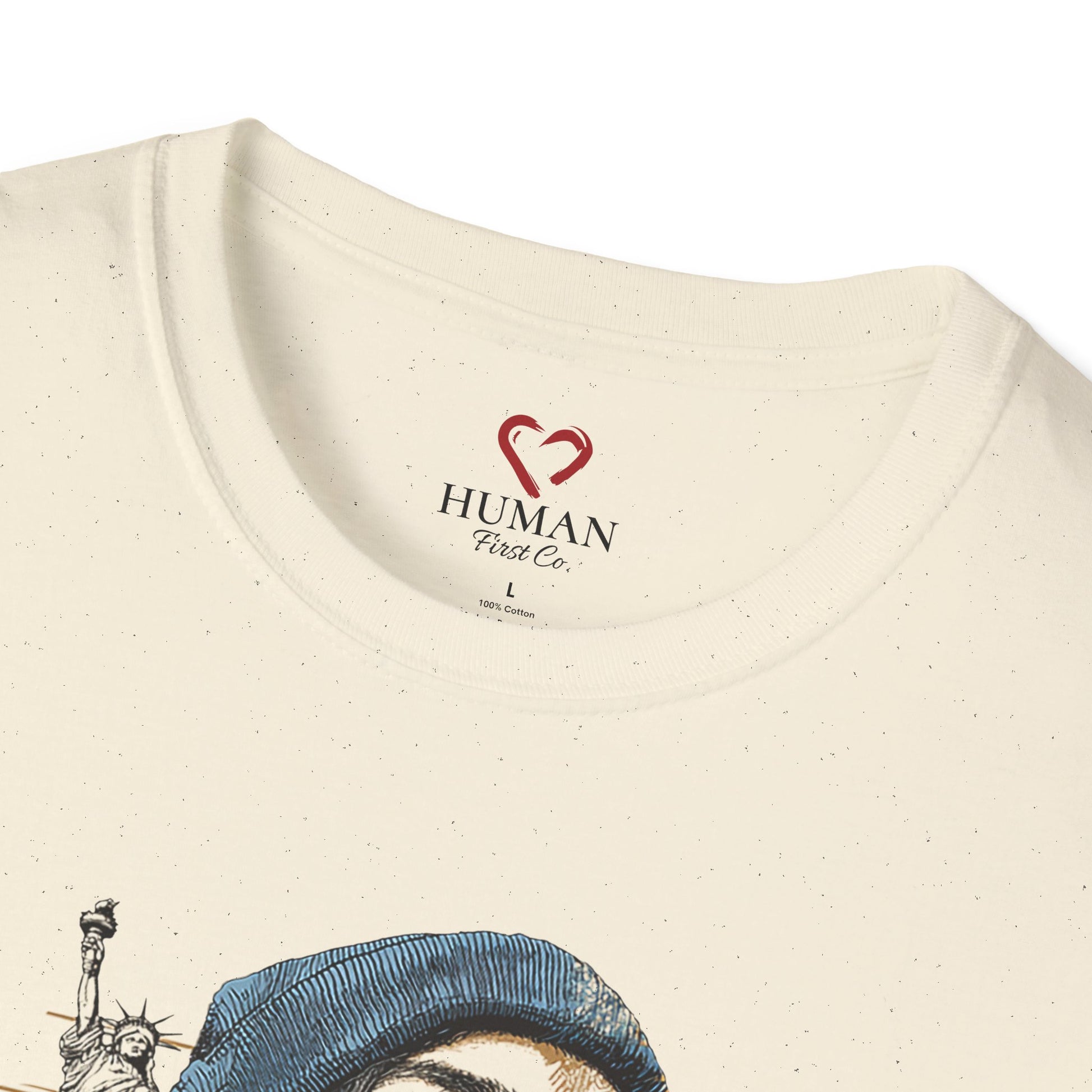 Close-up collar view of Human First Co. humanitarian t-shirt showing branded neck label and garment details.