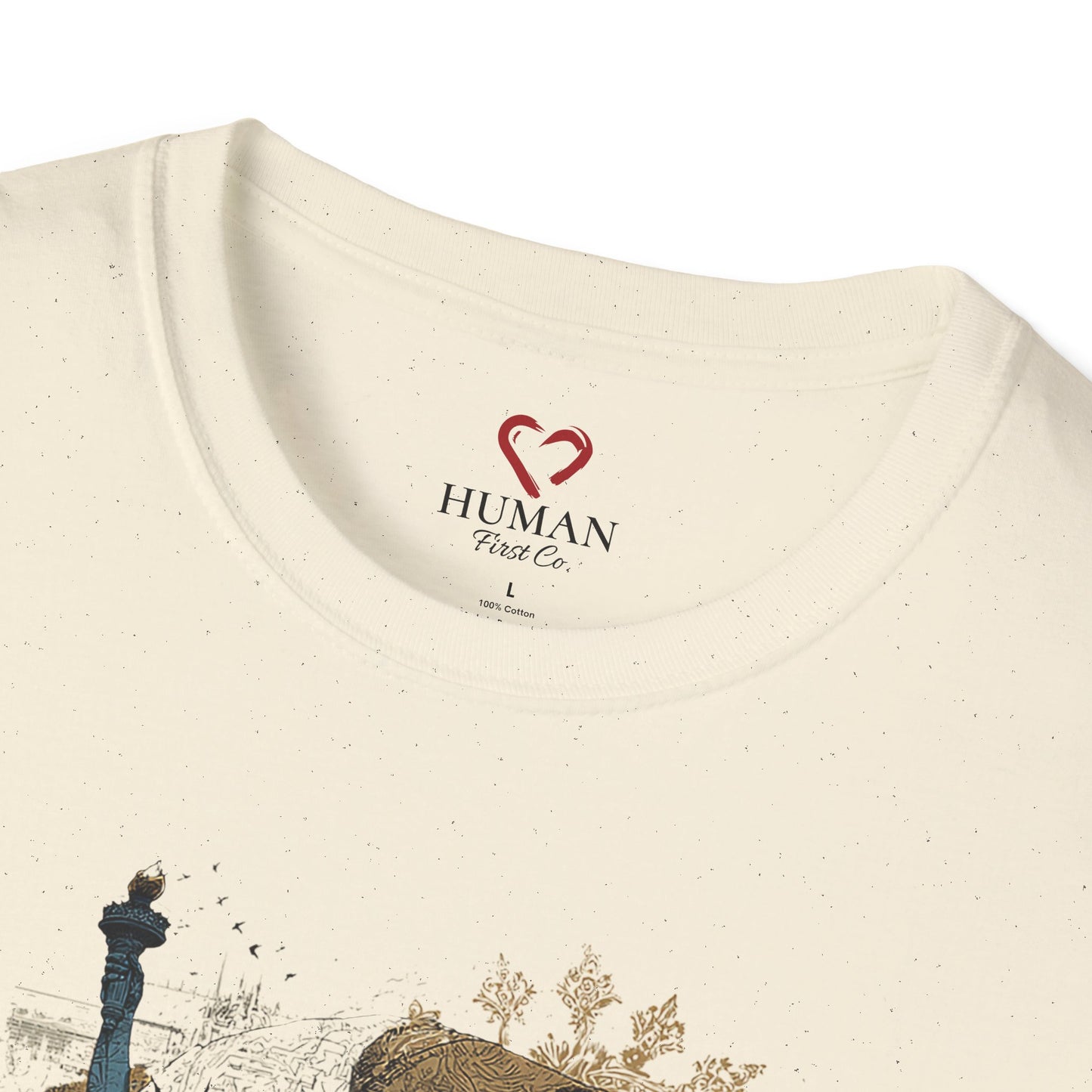 Close-up collar view of Human First Co. humanitarian t-shirt showing branded neck label and garment details.